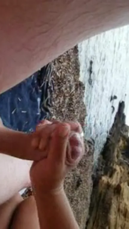 Branlette de bite sur la plage